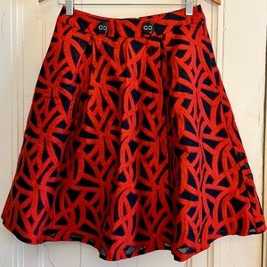 Vibrant red and navy full skirt with pockets. Size 4 petite